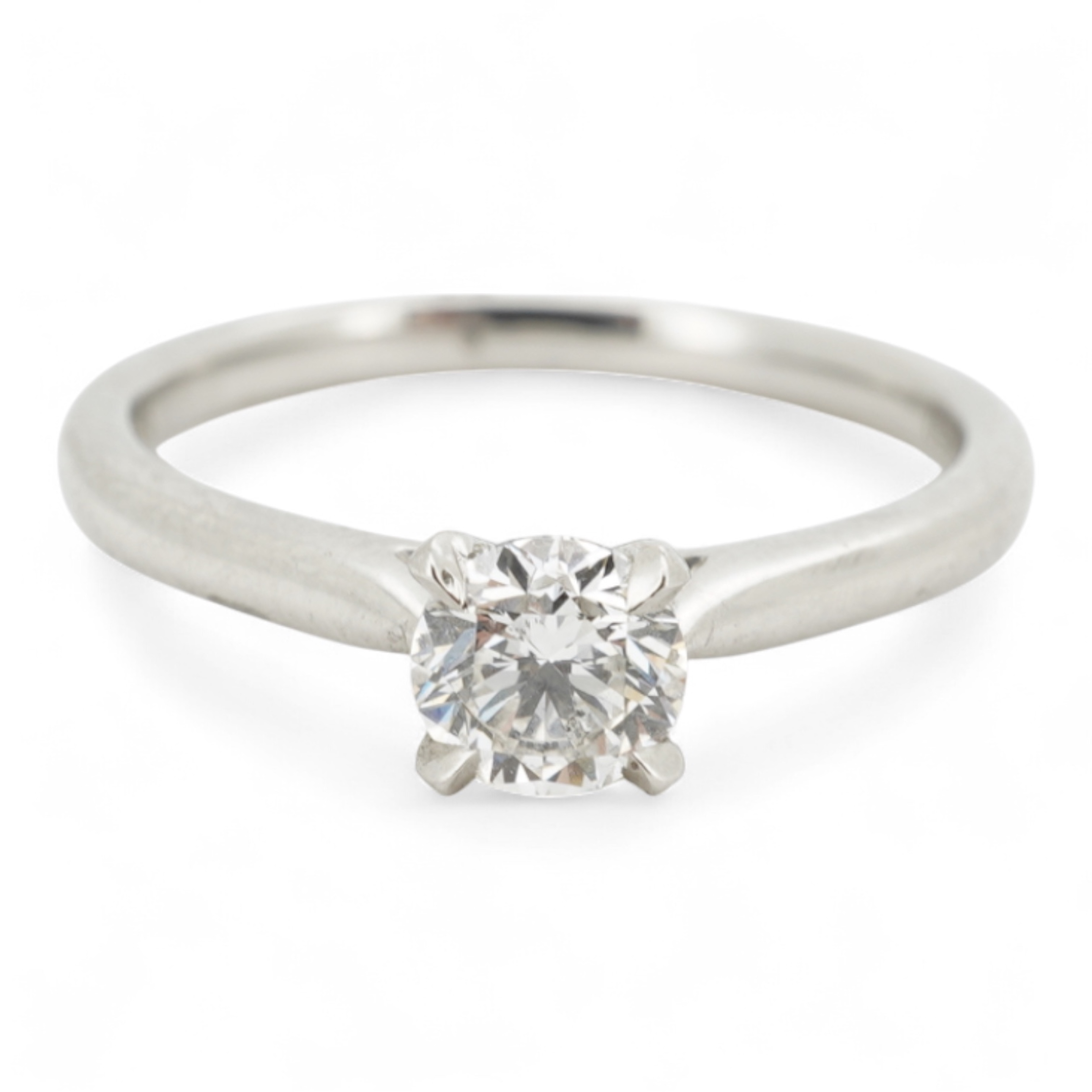 A diamond ring, claw-set with a brilliant-cut diamond weighing approximately 0.57 carats, mounted in platinum, size M, British hallmarks, gross weight approximately 3 grams